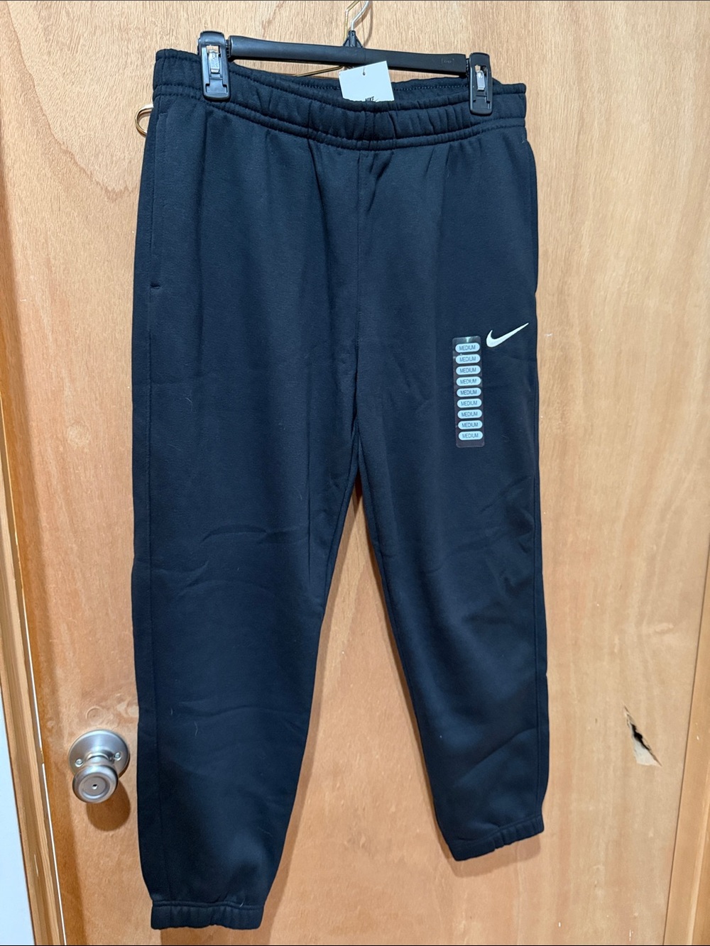 Nike Kids Black Joggers with White Swoosh